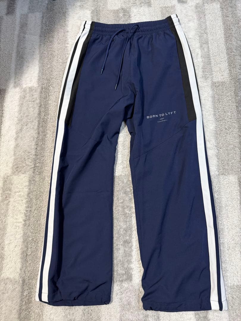 パンツ LYFT 2LINE ADJUSTABLE WIDE TRACK PANTS