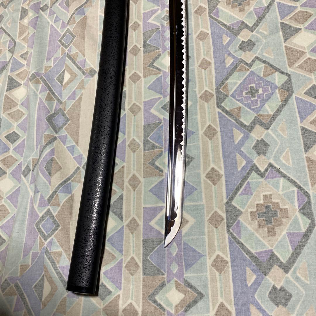 上級居合刀 黒柄 龍彫透し金縁丸鍔 黒梨地鞘