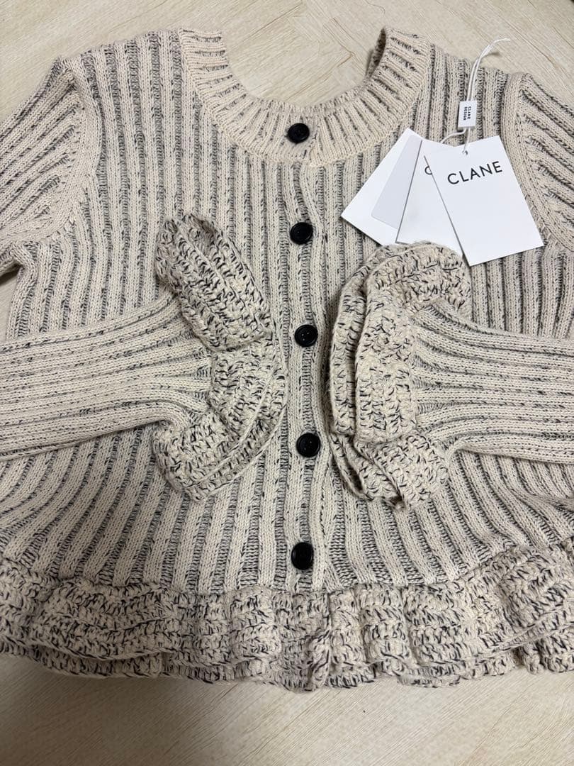 CLANE クラネ W FACE SHORT FRILLED KNIT TOPS
