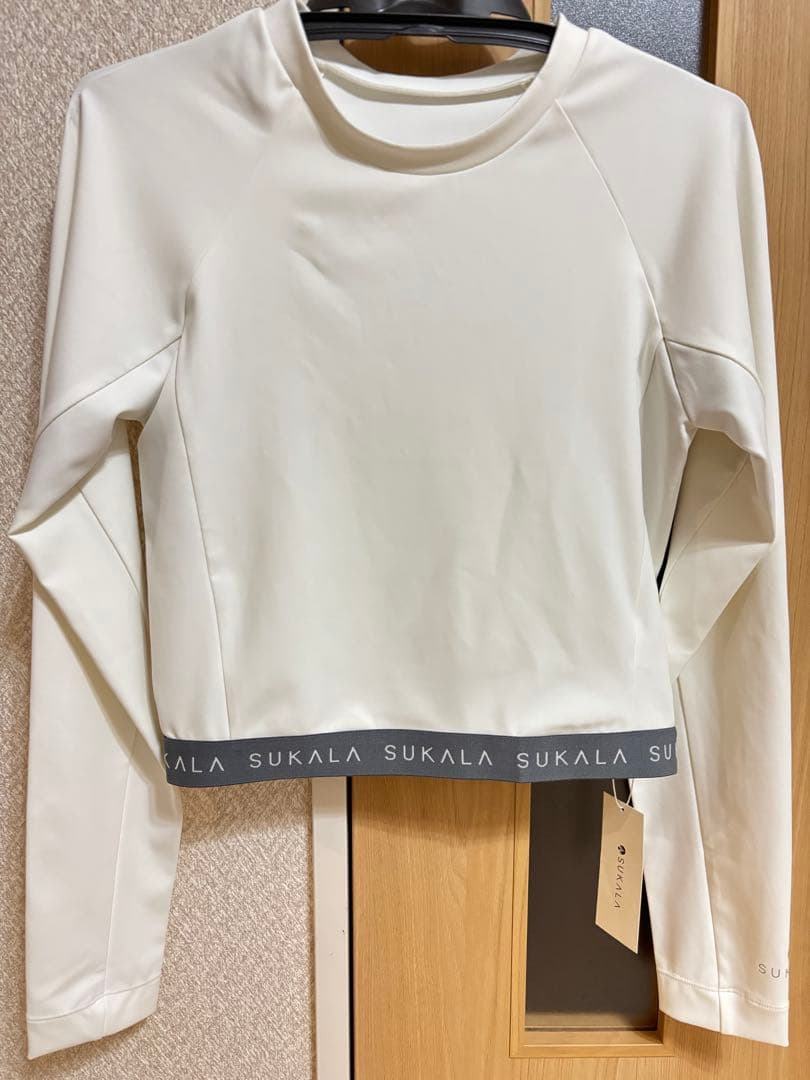 SUKALA ロゴジャガードロングスリーブトップス