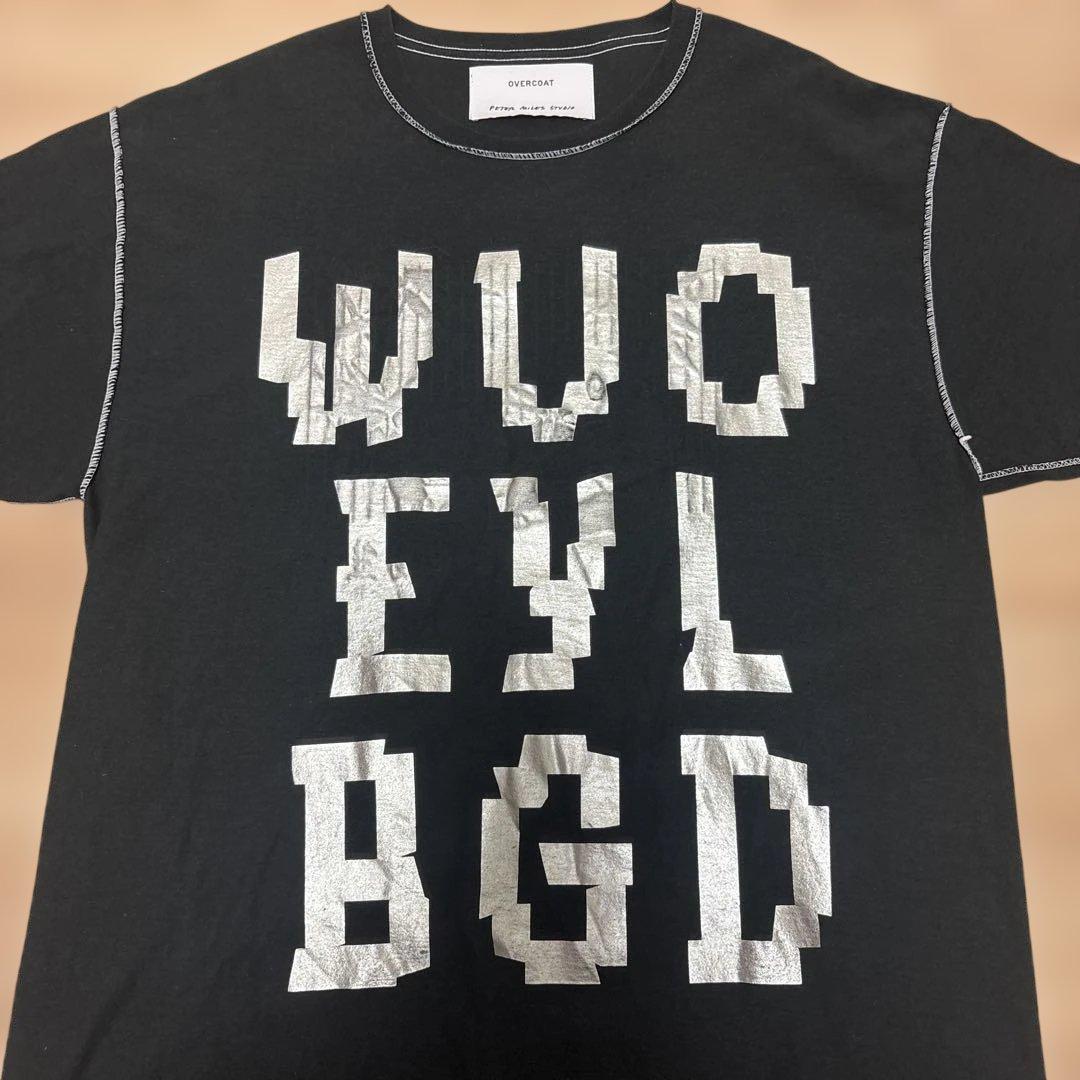 OVERCOAT WE BUY GOLD プリントTシャツ