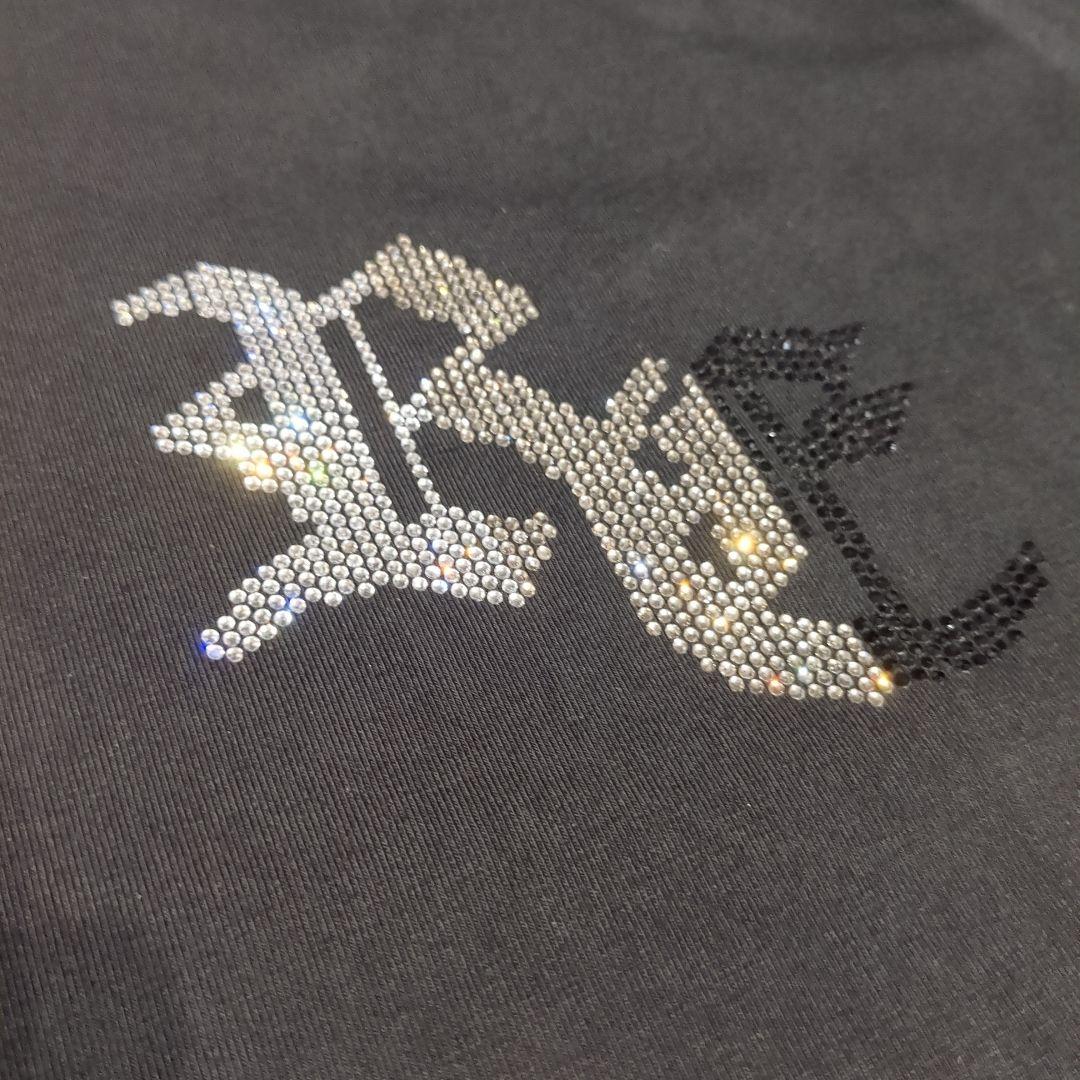 アダムスジャグラー ブラック Tシャツ