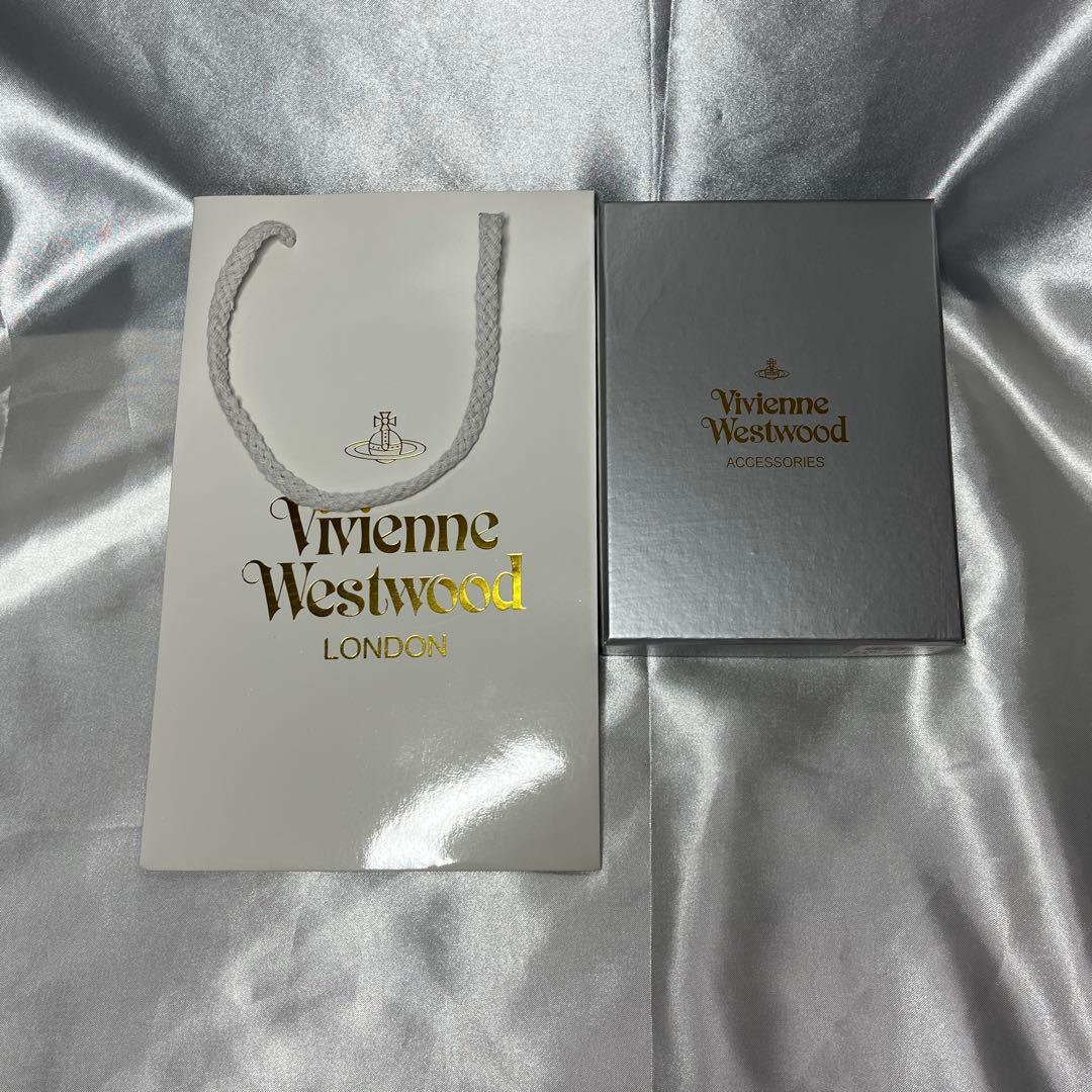 新品Vivienne Westwood 茶 コーヒー 蝶々留め 二つ折り財布